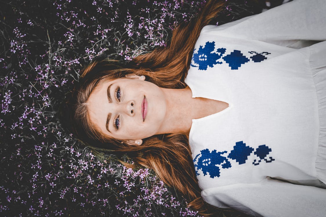 Free Photo of Woman Lying on Flowes Stock Photo