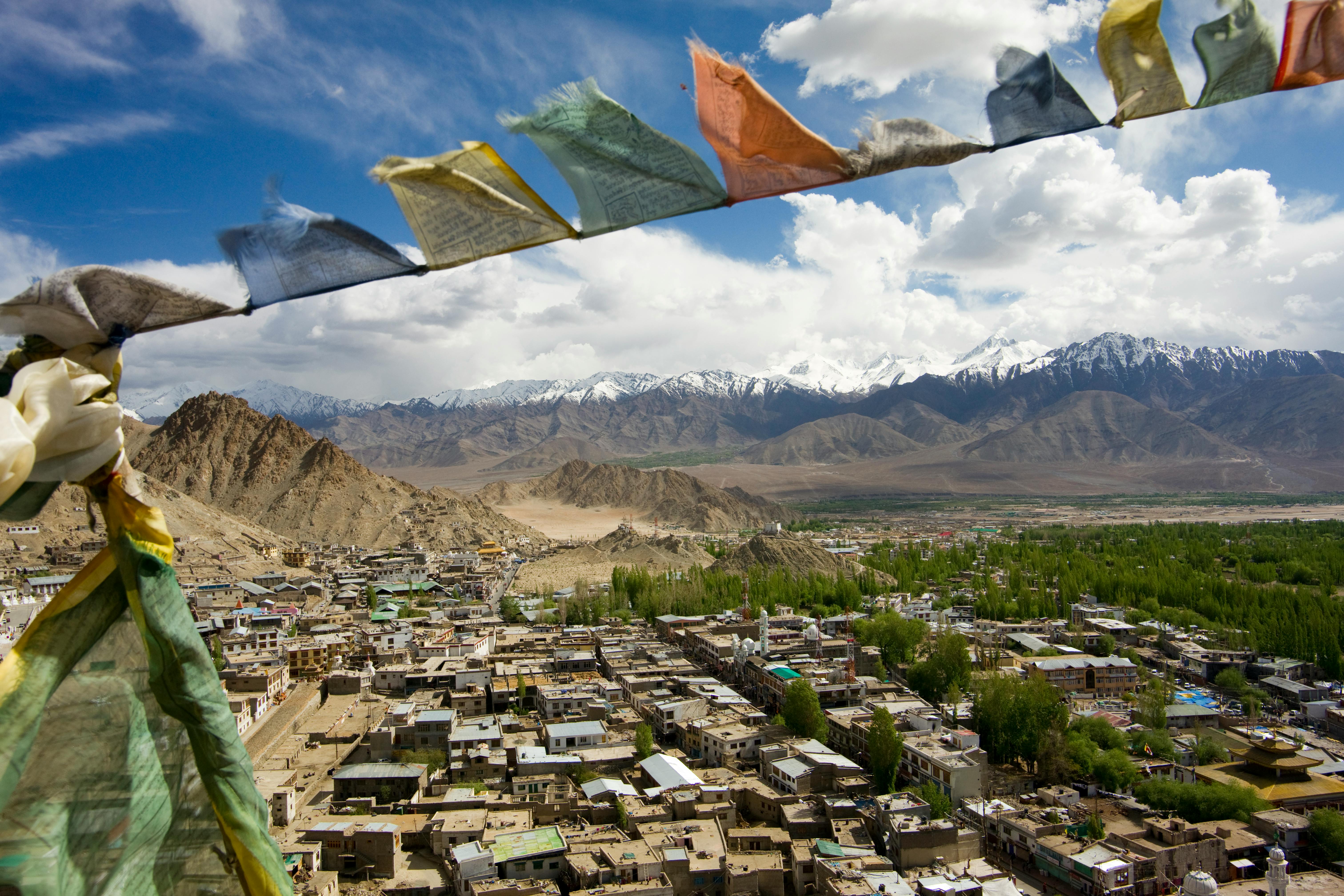 Houses Surrounded by Mountains during Daylight