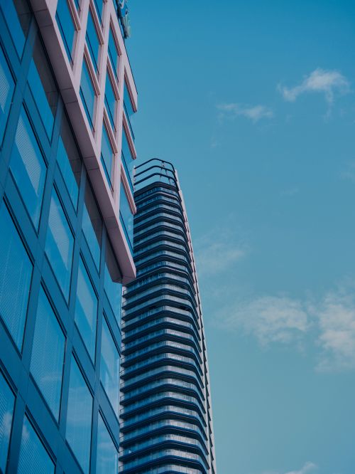 Free Low angle view of sleek modern skyscrapers in Bratislava, showcasing urban architecture against a clear blue sky. Stock Photo