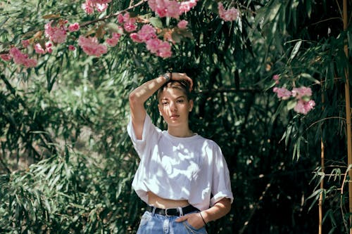 Photo of Person Standing Near Plants