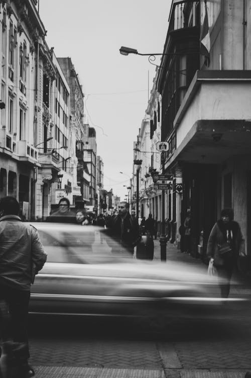 Monochrome Photo of People Walking on Street