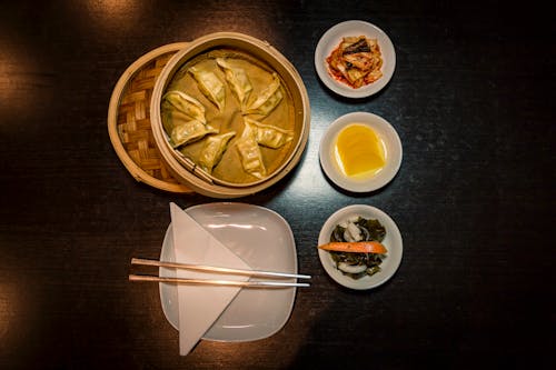 Chopsticks on Plate Near Foods on Plates