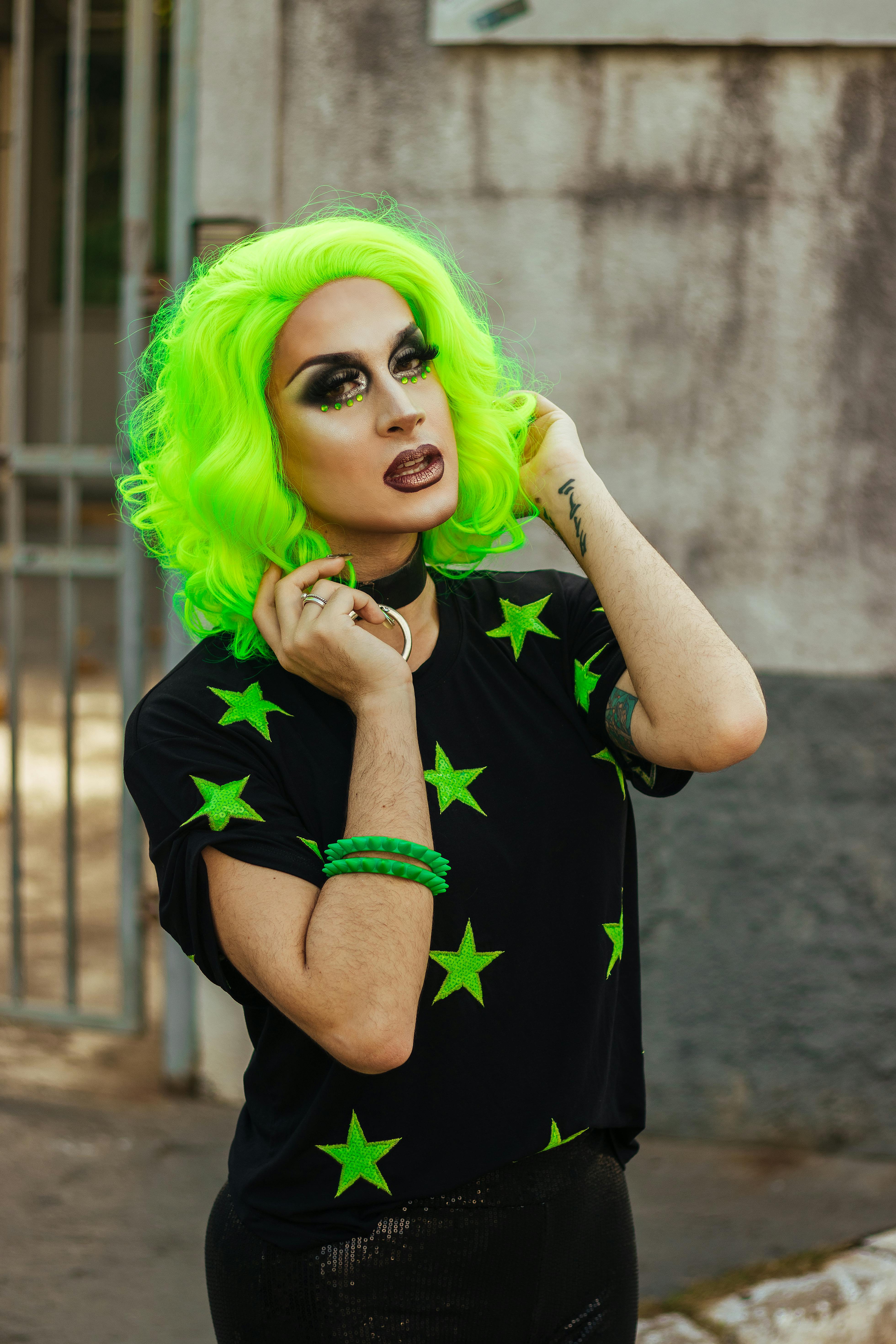 Woman Wearing Green and Black Crew-neck Shirt