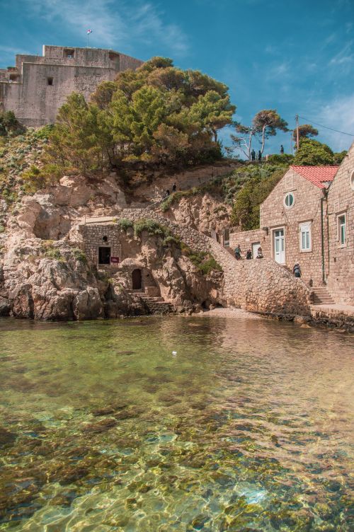 Free Explore the stunning coastal architecture and clear waters of Dubrovnik, Croatia's historic city. Stock Photo