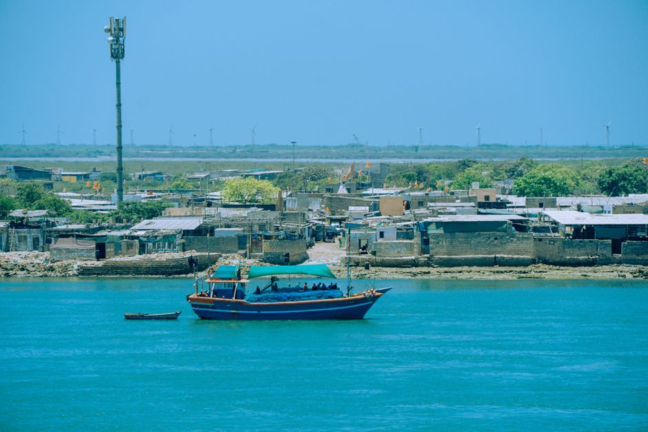 Traditional fishing boat anchored near a coastal village in Dwarka, India.