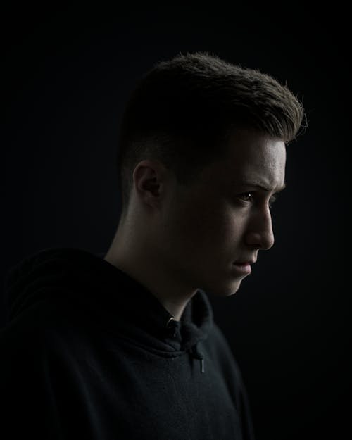 Side View Portrait Photo of Man in Black Hoodie