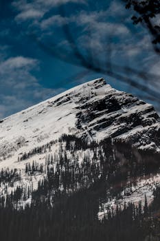 Stunning snow-capped mountain in Himachal Pradesh, India, perfect for winter landscape photography.