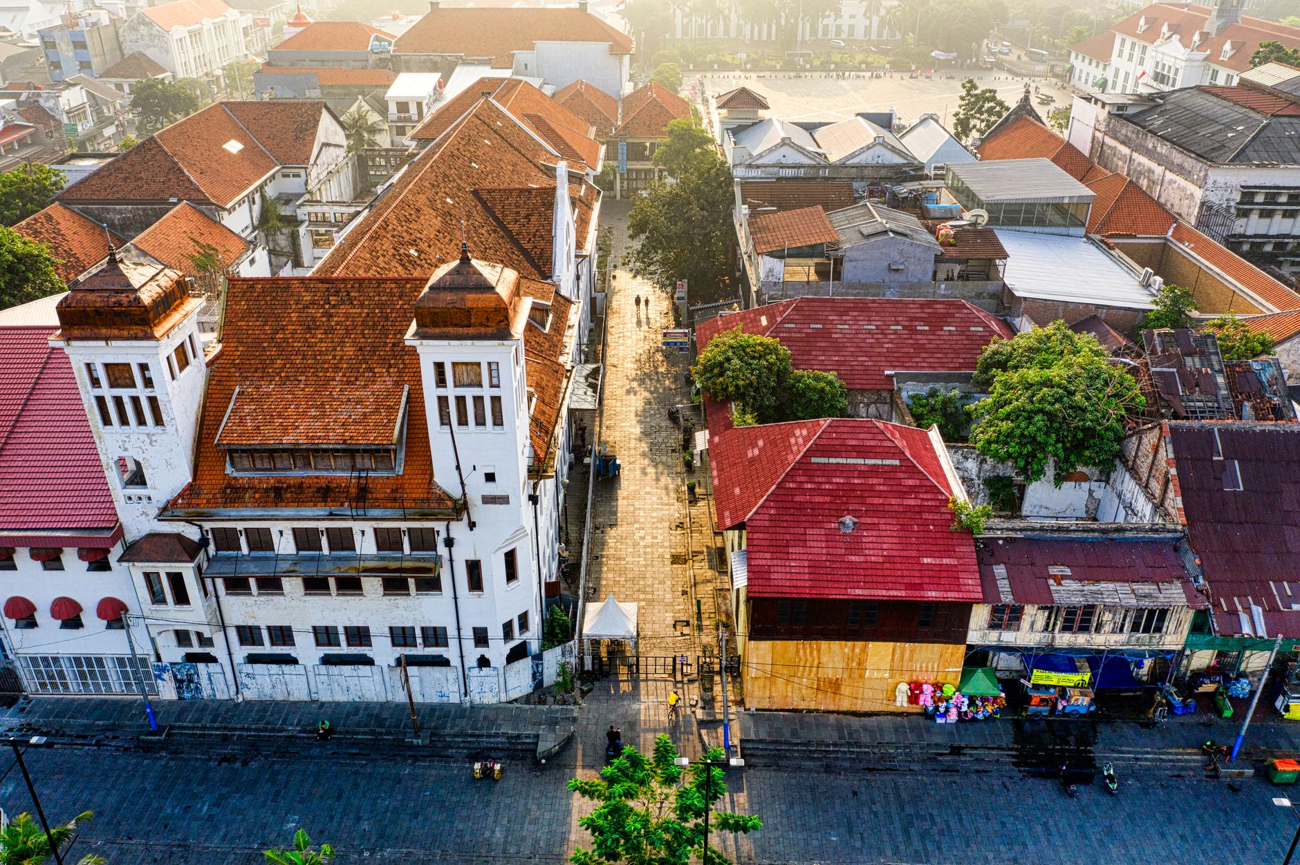 Breathtaking aerial shot of Jakarta's old town, showcasing traditional architecture under a clear morning sky.