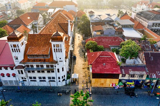 Photo by Tom Fisk Breathtaking aerial shot of Jakarta's old town, showcasing traditional architecture under a clear morning sky.