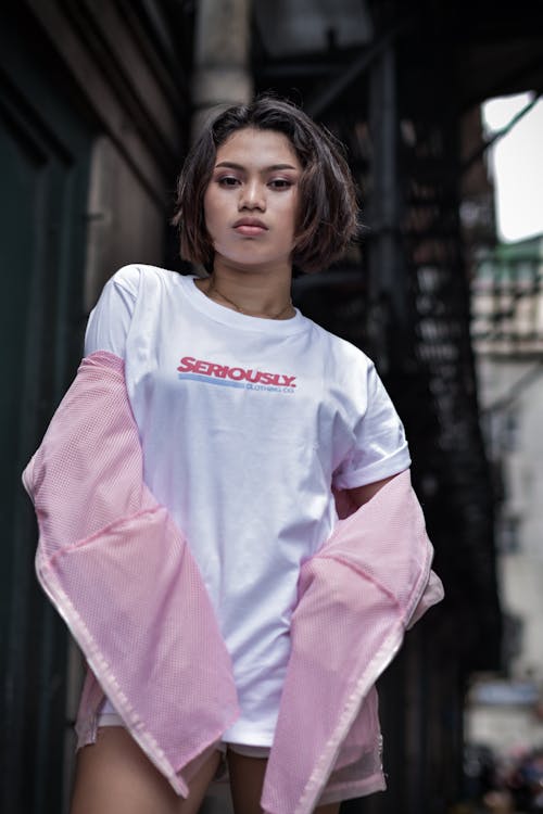 Shallow Focus Photo of Woman in White Crew-neck T-shirt