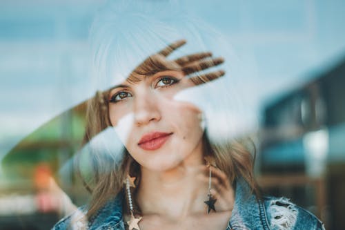 Shallow Focus Photo Of Woman In Blue Denim Distressed Jacket