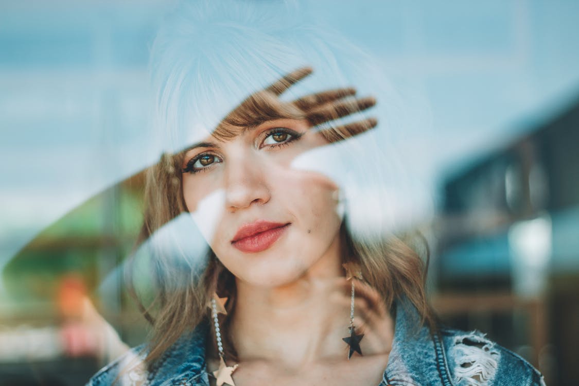 Free Shallow Focus Photo Of Woman In Blue Denim Distressed Jacket Stock Photo