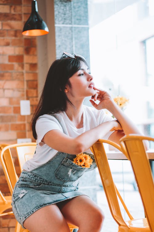 Woman In Denim Jumper Looking Sideways