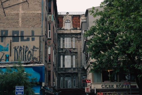 A street with buildings and graffiti on it