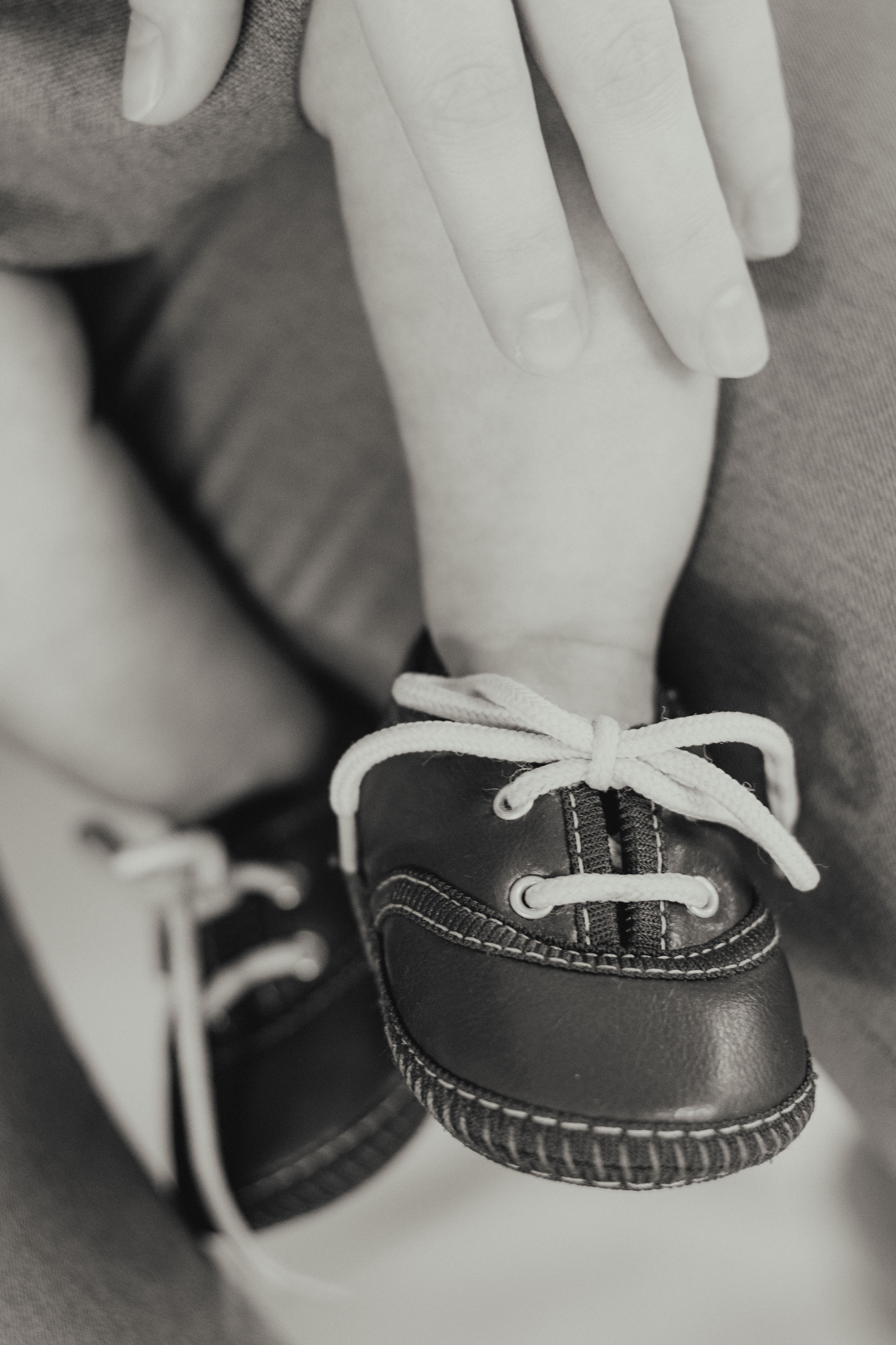 Mother Fingers over Baby Leg · Free Stock Photo