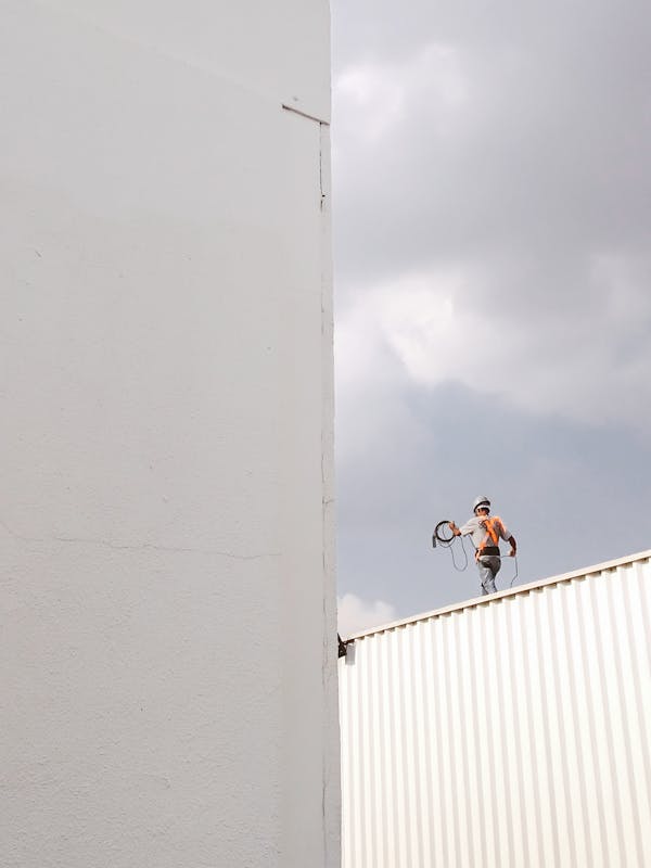 Man Walking on Roof Top