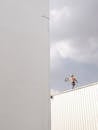 Man Walking on Roof Top