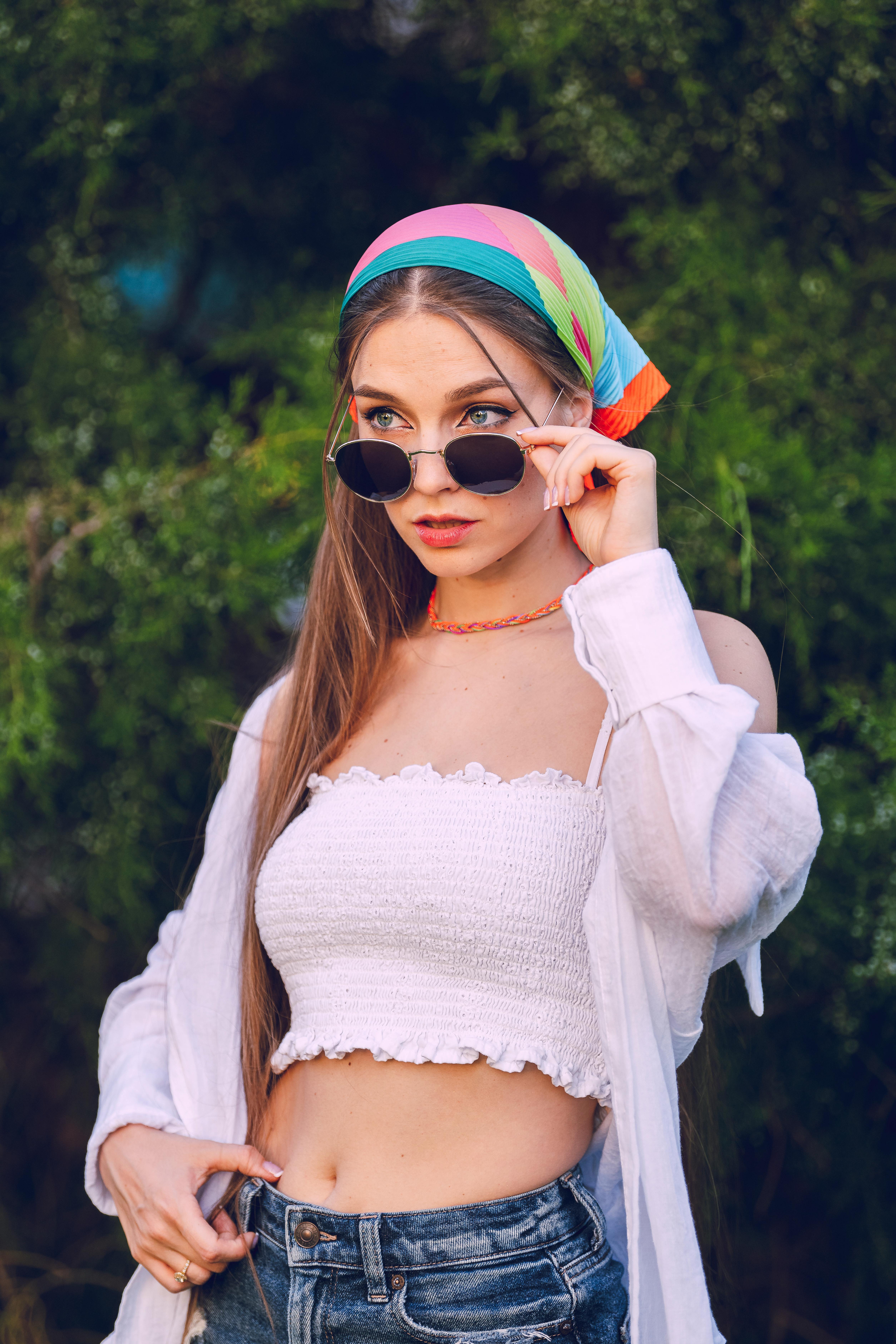 portrait of woman in top and sunglasses