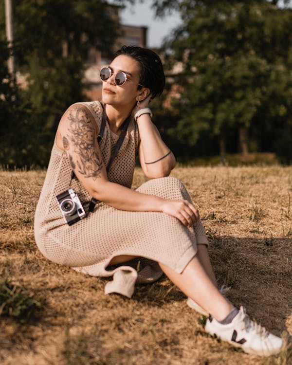 Woman in Sunglasses and with Tattoo