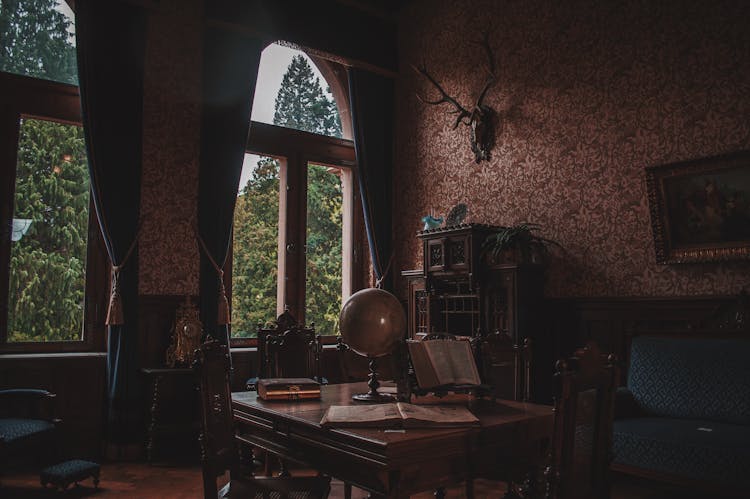 Antique Chairs And Table On An Old Room 