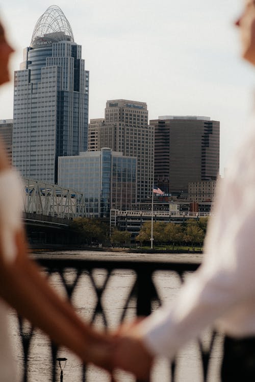 couple holding hands in downtown city