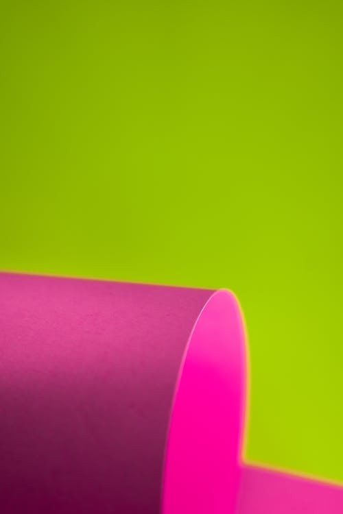 Abstract background. Rolled colorful sheets of paper.