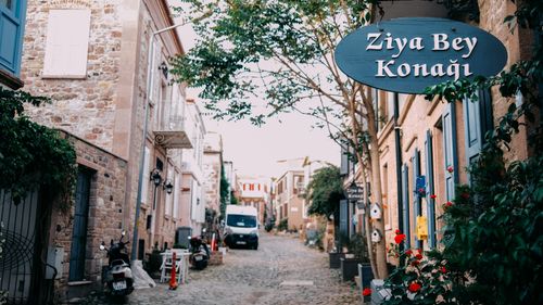 Free Explore the picturesque city streets of Balikesir, Turkey, featuring historic stone houses and vibrant flowers. Stock Photo