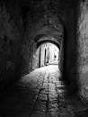 A black and white photo of an alleyway