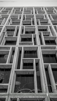 Black and white photo of a geometric facade on an abandoned building in Nicosia, Cyprus.