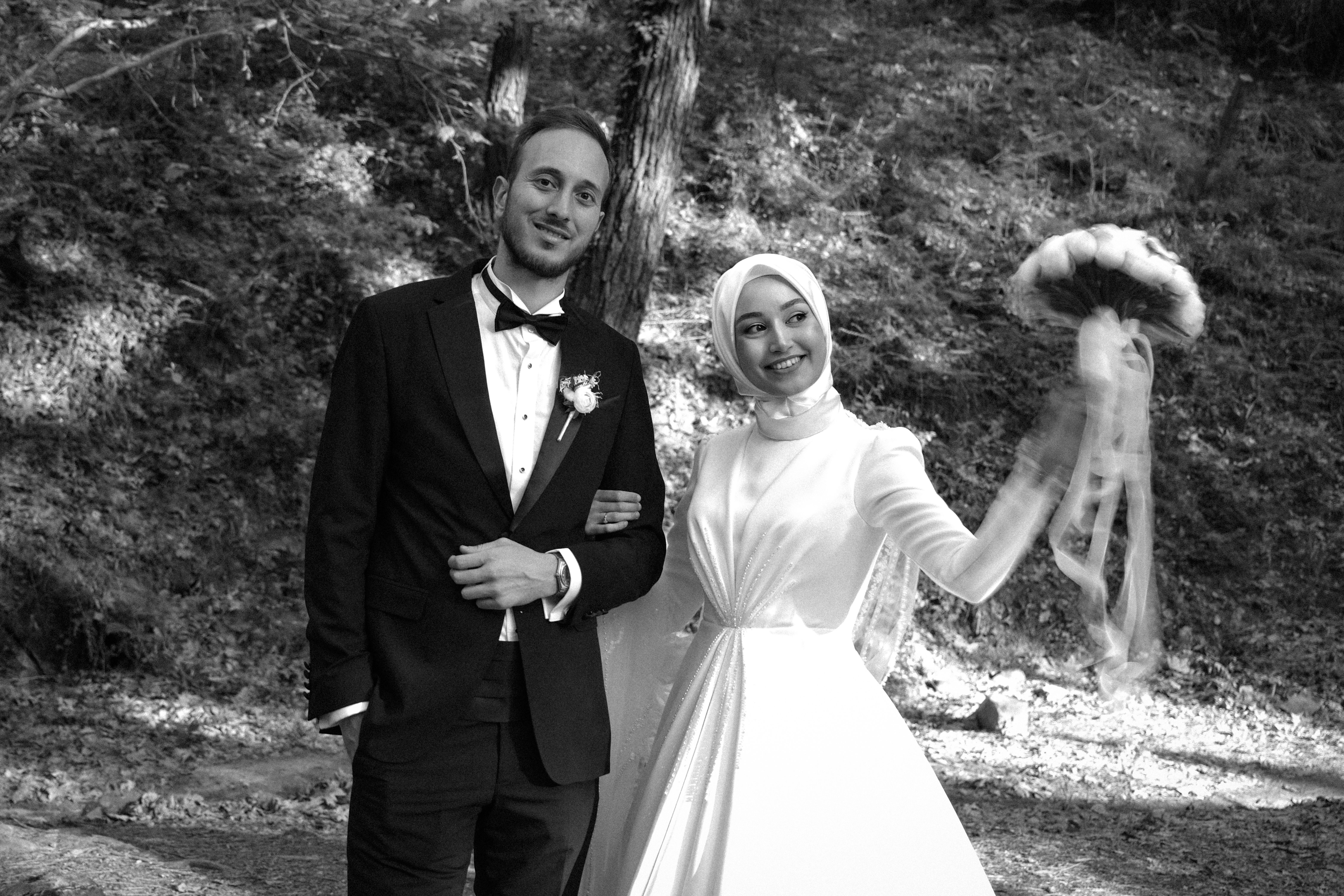 Smiling Newlyweds in Forest in Black and White