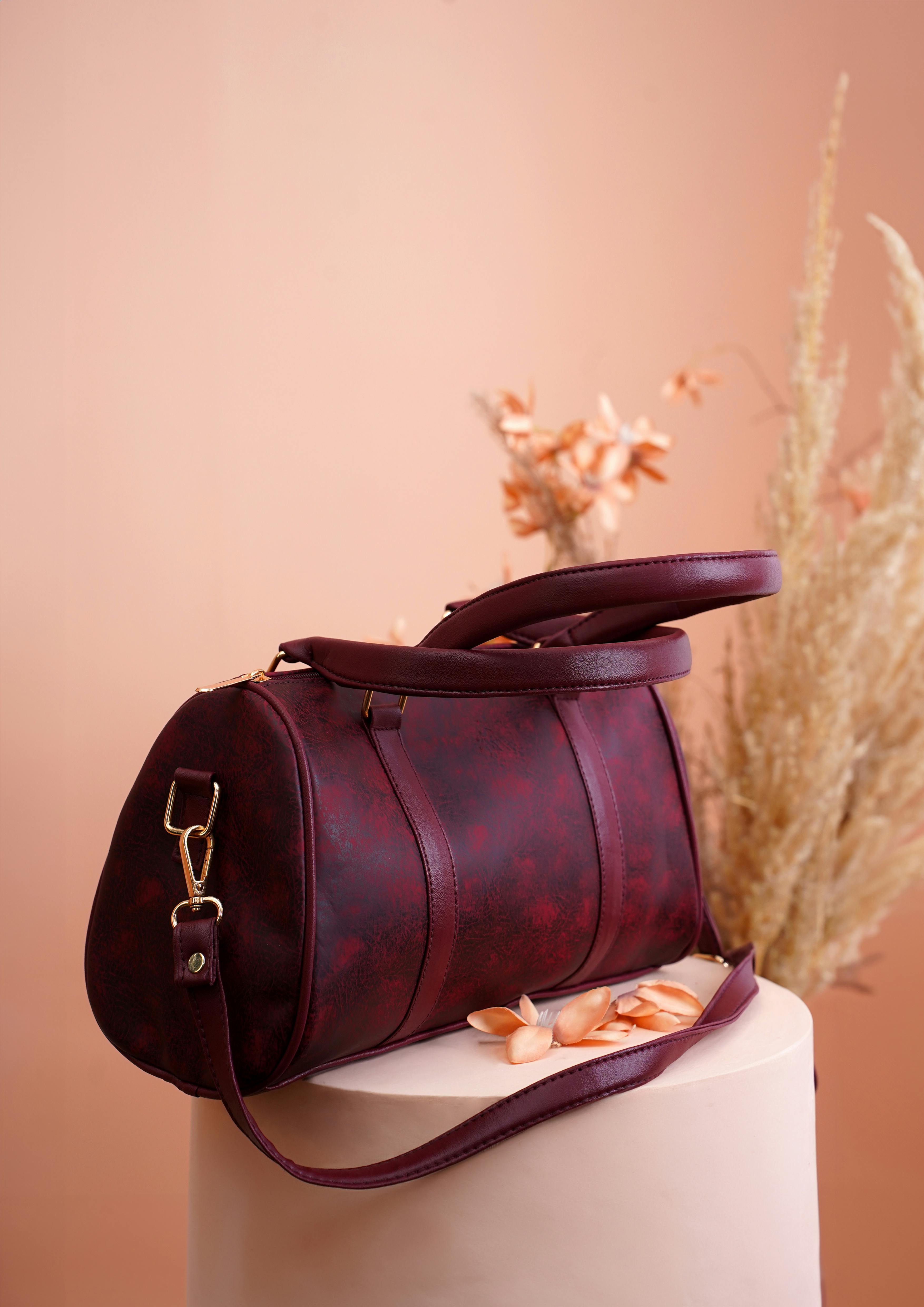 product shot of a burgundy bag