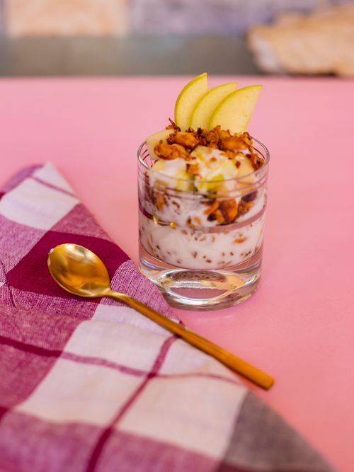 Free Tasty apple and nut dessert served in a glass, perfect for sweet indulgence. Stock Photo