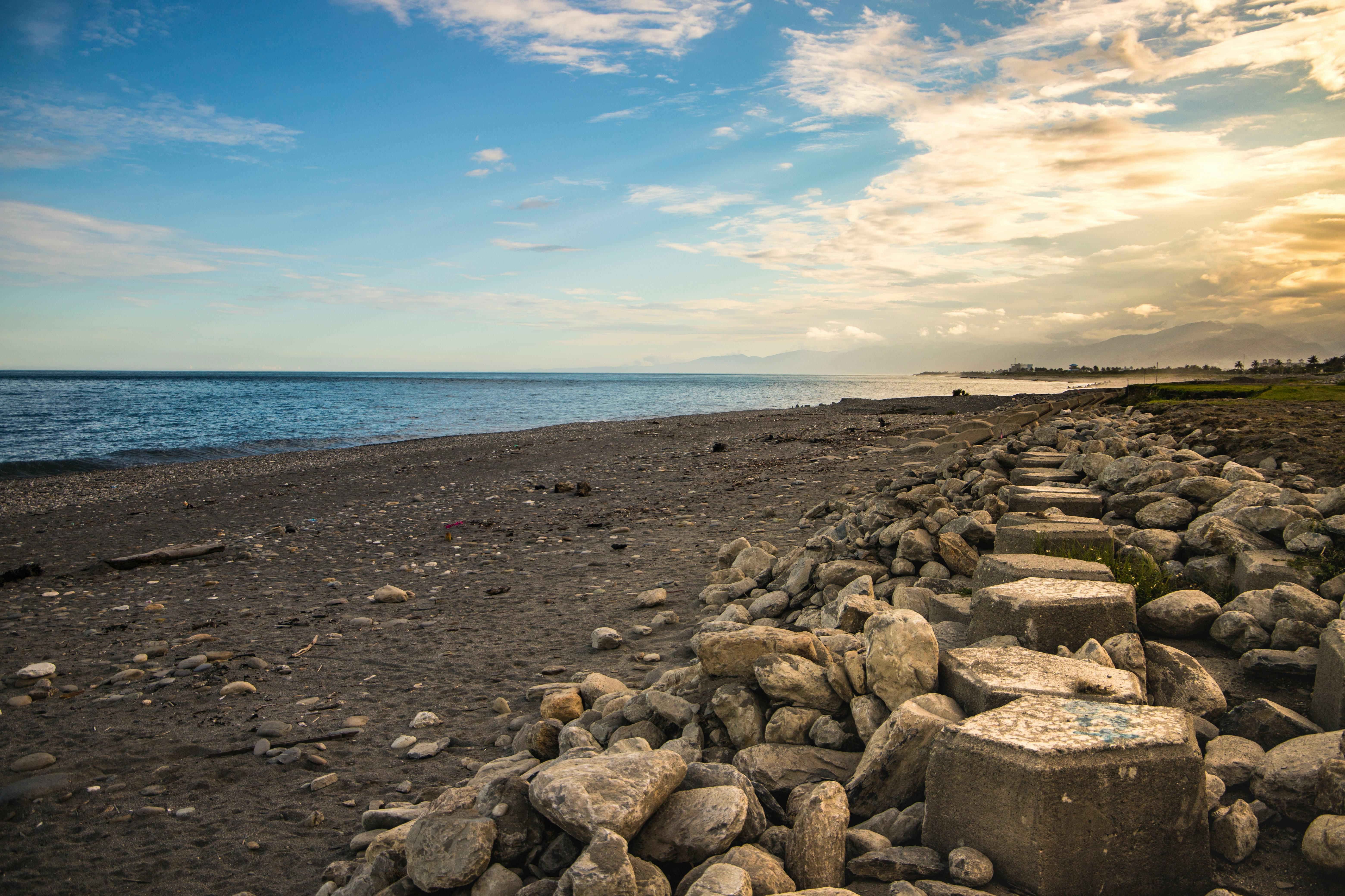 Beautiful rocky shoreline at sunset in Taitung, Taiwan with a serene ocean view