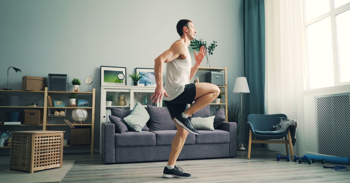 person doing quick morning exercise in living room with timer visible