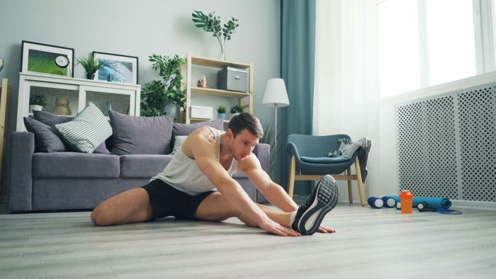 Man stretching at home — Vitaly Gariev on Pexels