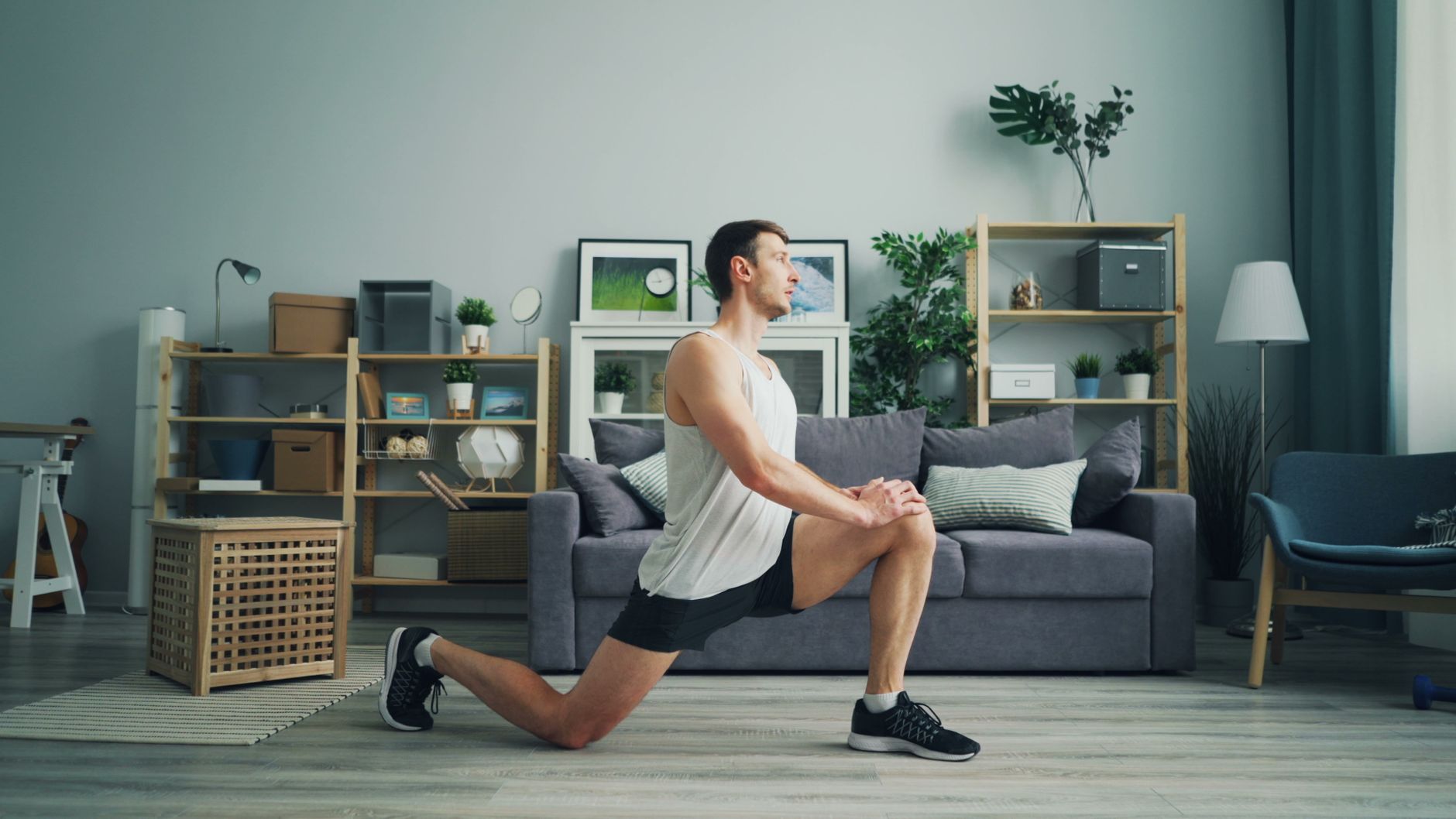 ivermectin long covid lung fibrosis — Man wearing sportswear doing lunges in a bright, modern living room environment.