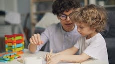 Boy and Mother Drawing on Table