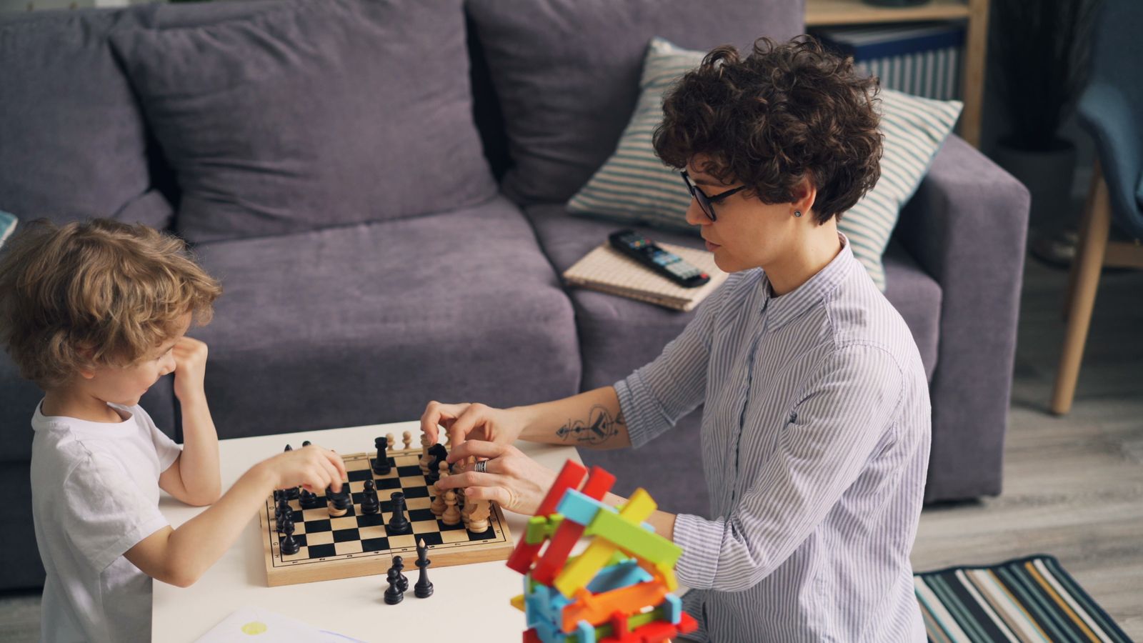 Parent and child playing chess