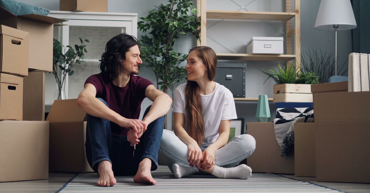 Young first-time buyers holding keys to a Toronto condo