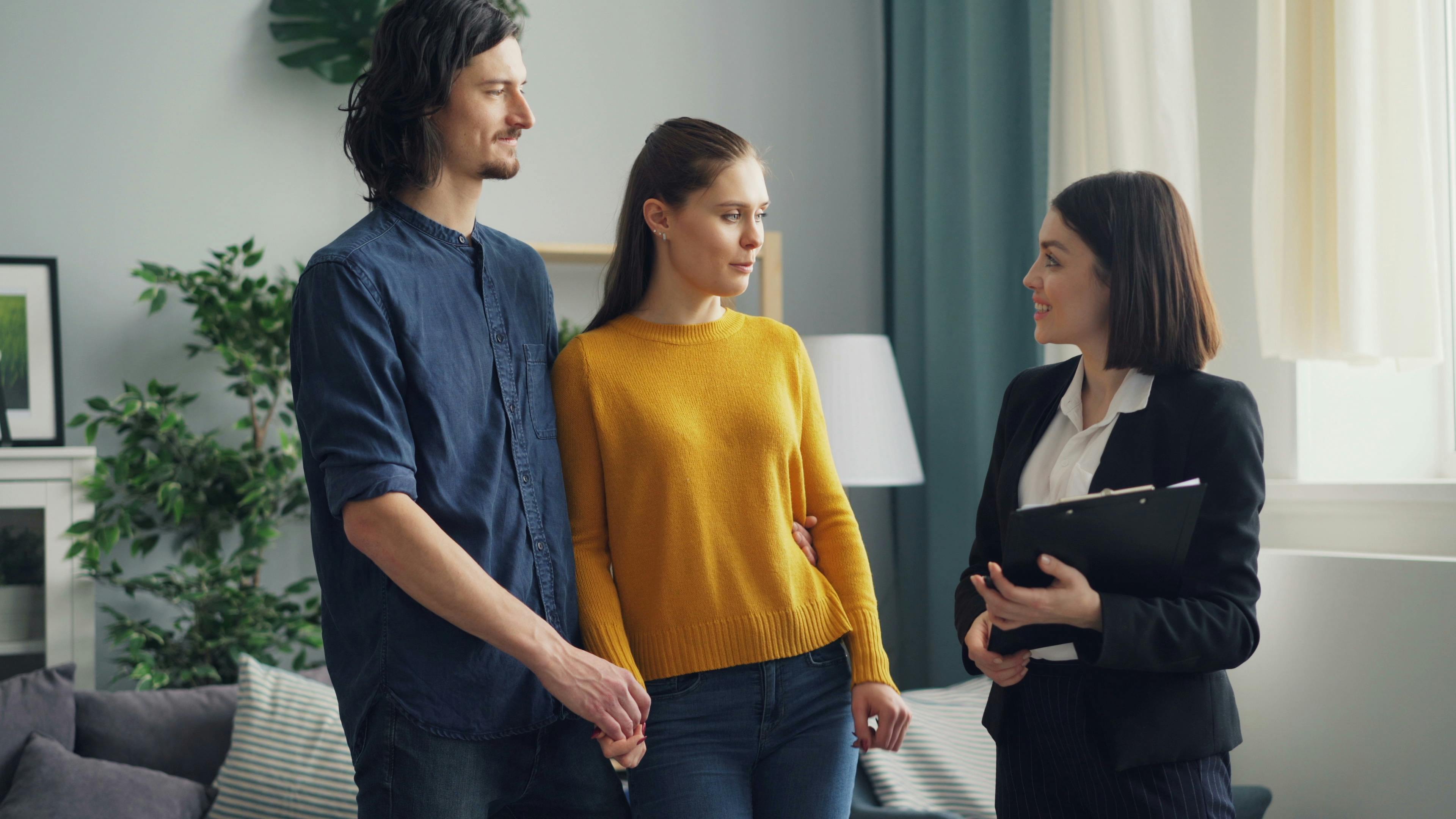 Real estate agent talking to clients