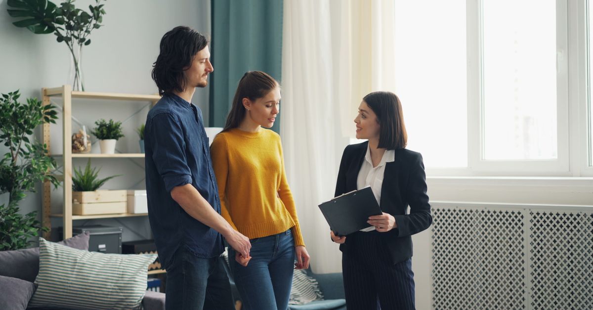 Couple touring an empty Toronto home with more negotiating power than buyers had in 2021