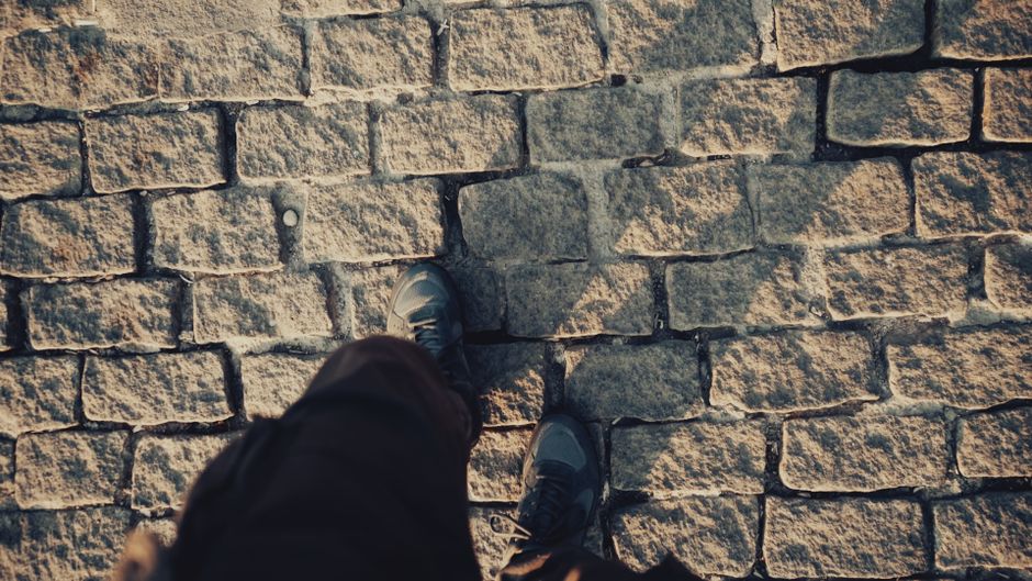 Comfortable walking shoes on a cobblestone street in Brașov, Romania