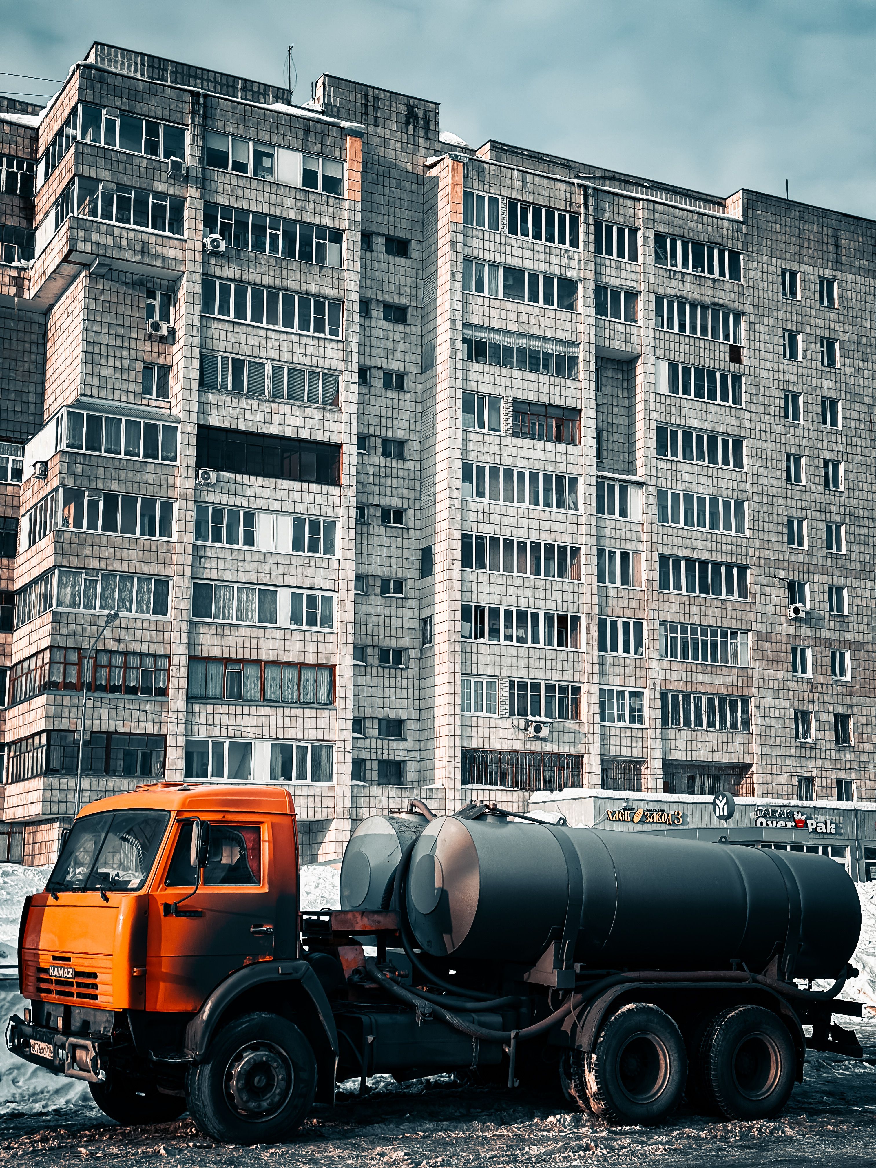 View of Urban Landscape with Industrial Truck and Building · Free Stock Photo