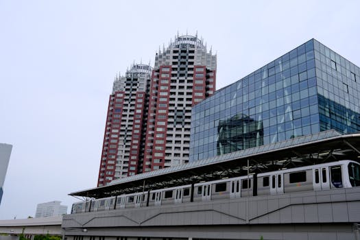 Capture of Tokyo skyline with metro passing modern buildings.