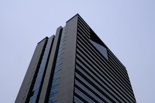 A tall building with a black and white stripe