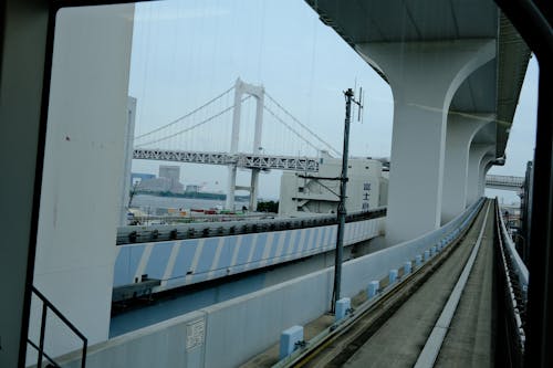 A view of a bridge from inside a train