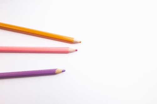 three colored pencils