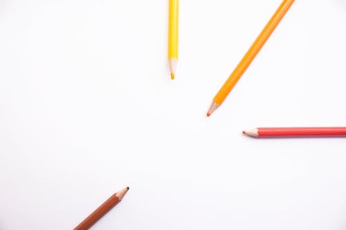 four colored pencils