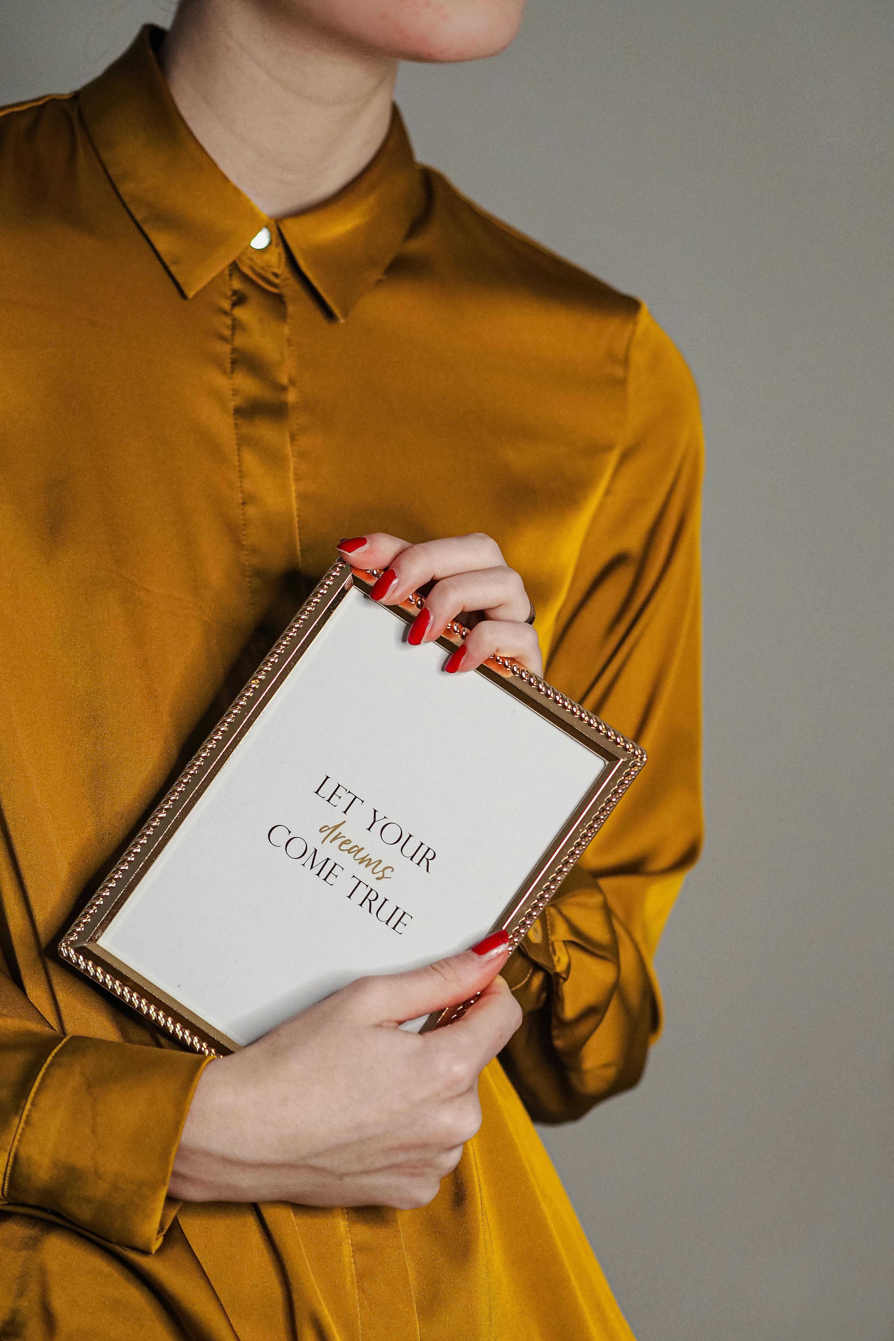 a person holding a frame