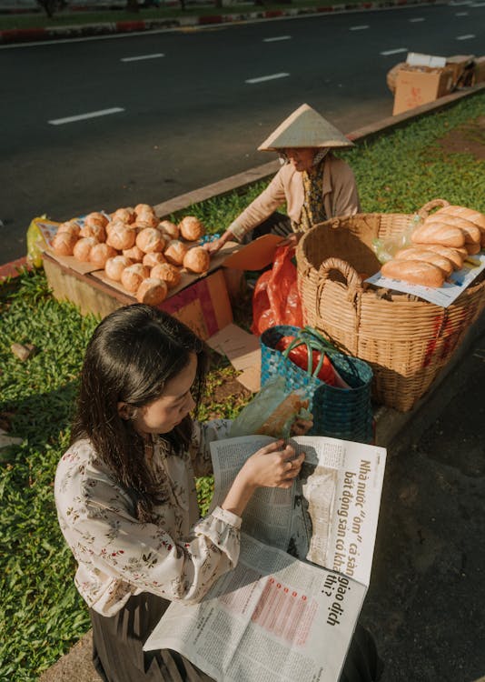 Morning routine with banh mi and newspaper